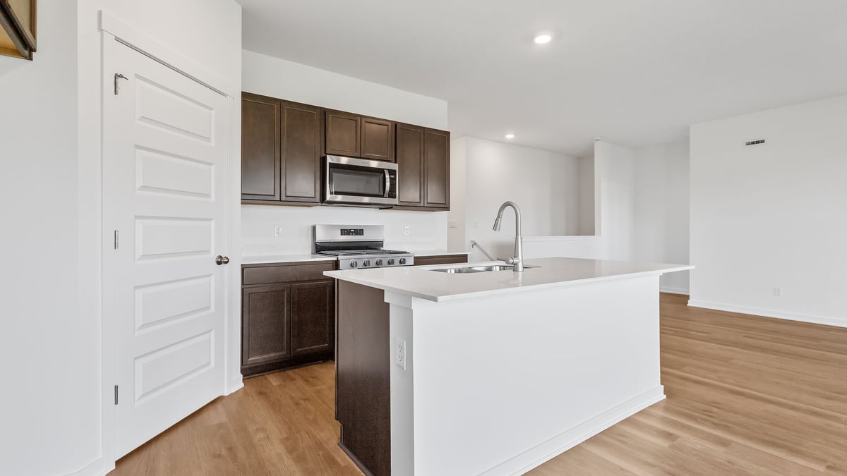 Kitchen with brown cabinets.