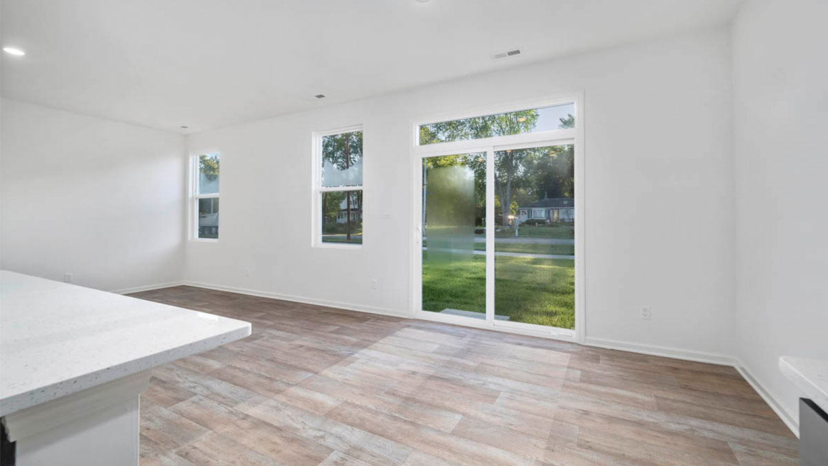 open concept dining room with access to back patio