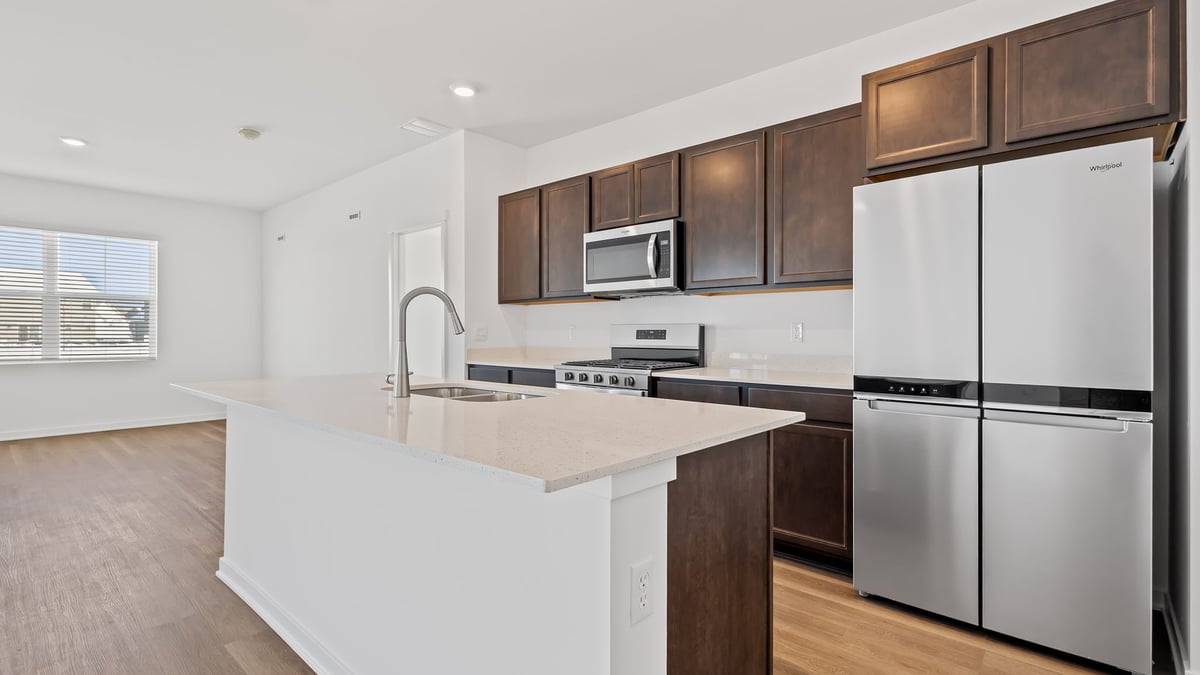 Kitchen with dark cabinets and a kitchen island.