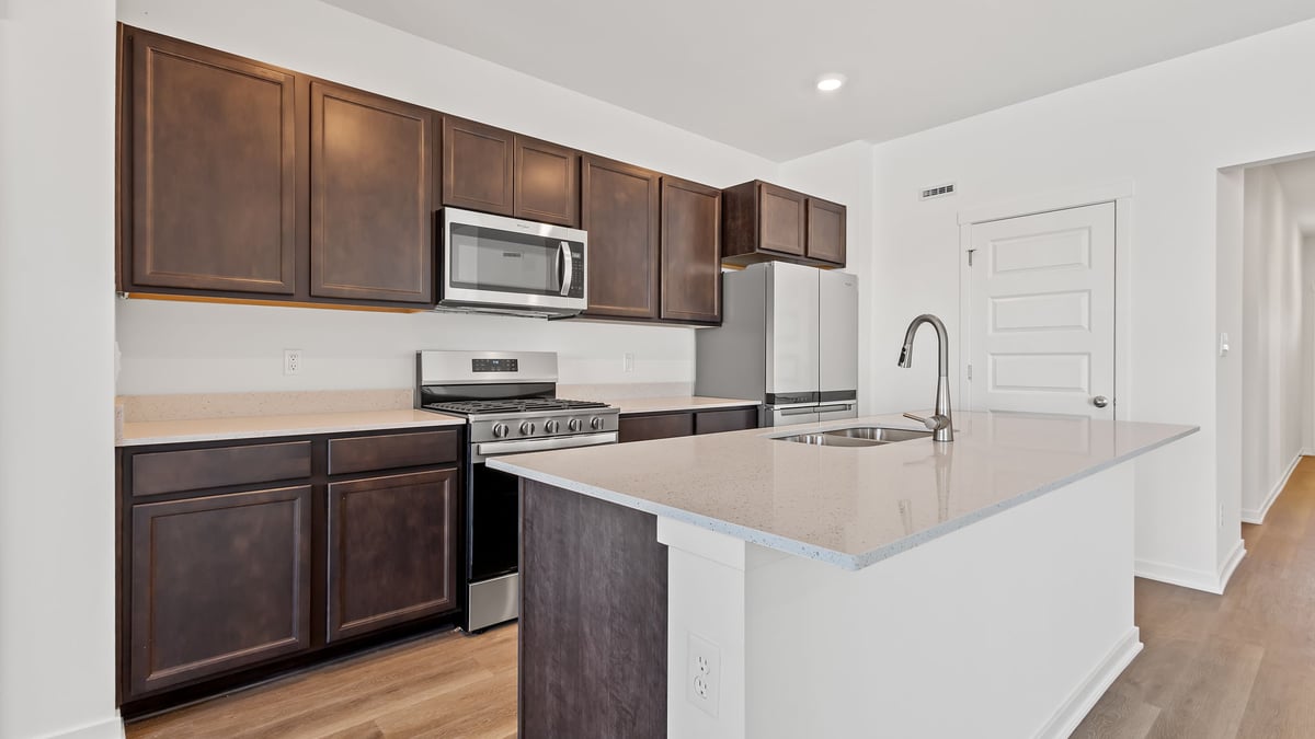 Kitchen with dark cabinets.