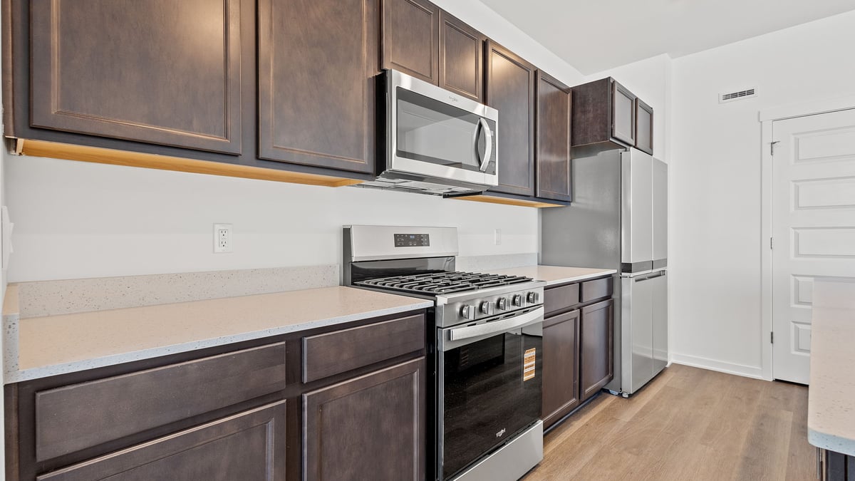 Kitchen with dark cabinets.