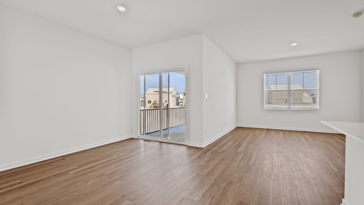 Dining area with hard wood floors and a glass sliding door.