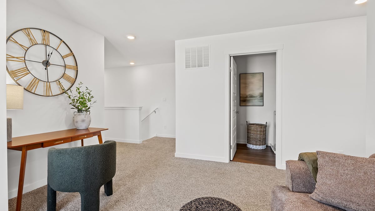 Loft area with carpet.