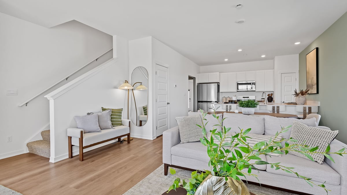 Living room area with hard wood floors and an open layout.
