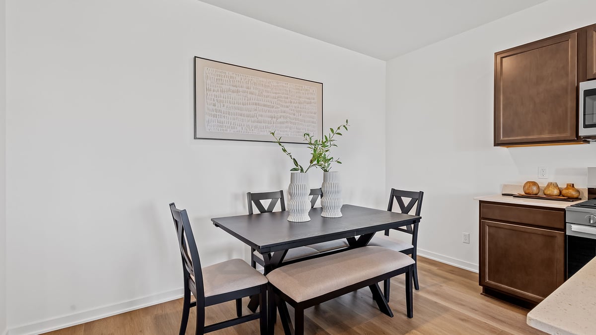 Dining room area with hard wood floors.