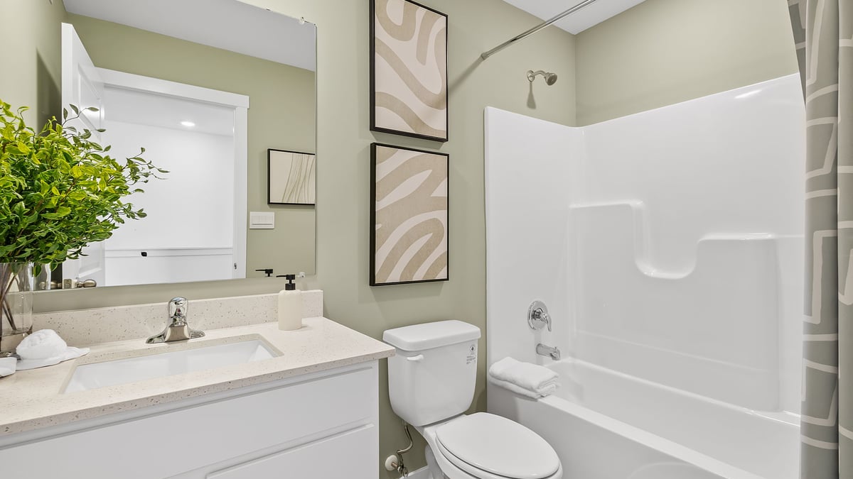 Bathroom with one vanity sink and a shower.