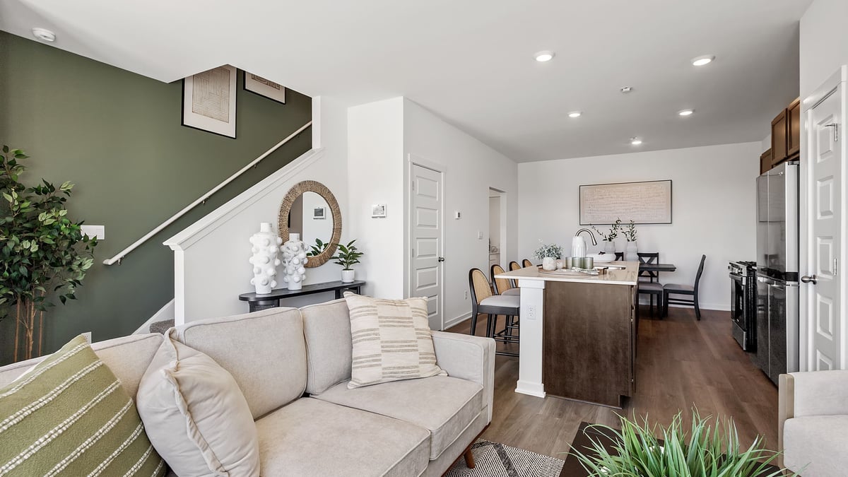 Living room area with a kitchen view.