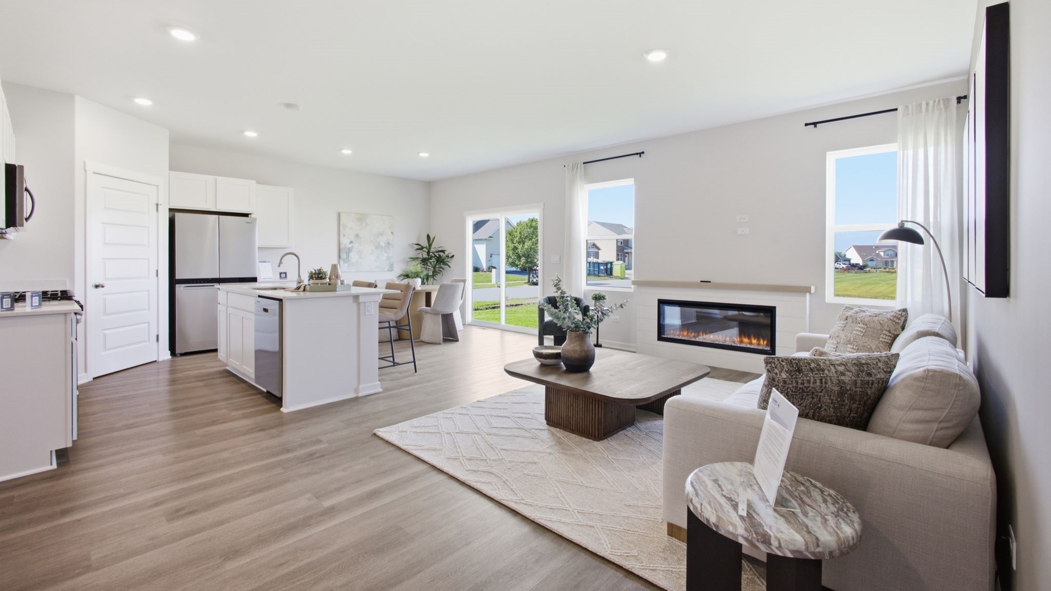 Living and kitchen area with hardwood floors.
