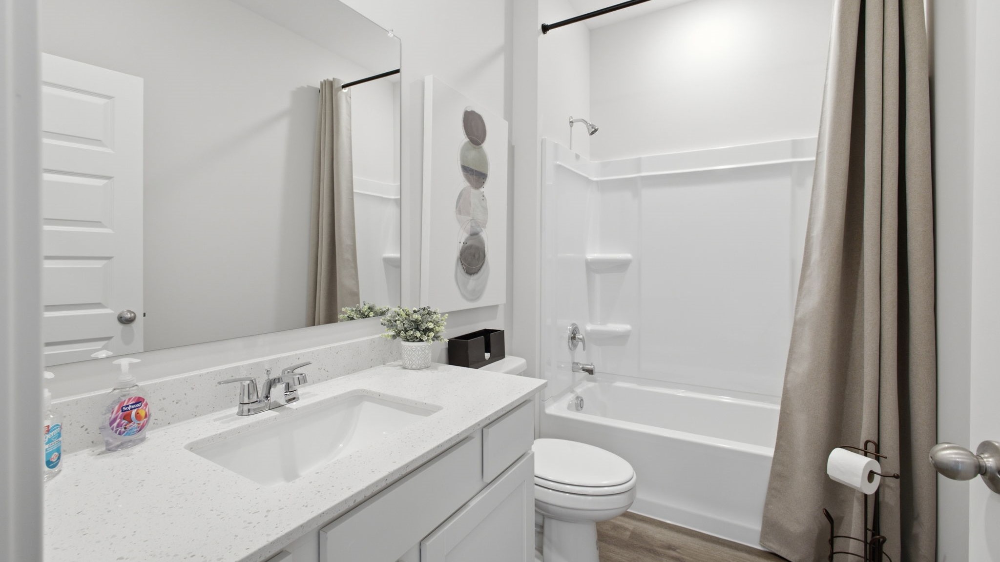 Bathroom with single sink and bathtub.