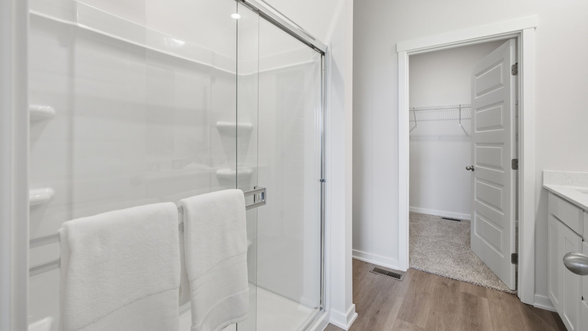 Primary bathroom with walk-in shower and closet.