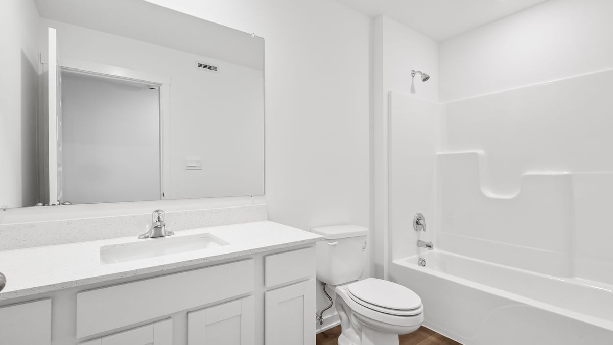 Bathroom with one vanity sink and a shower.
