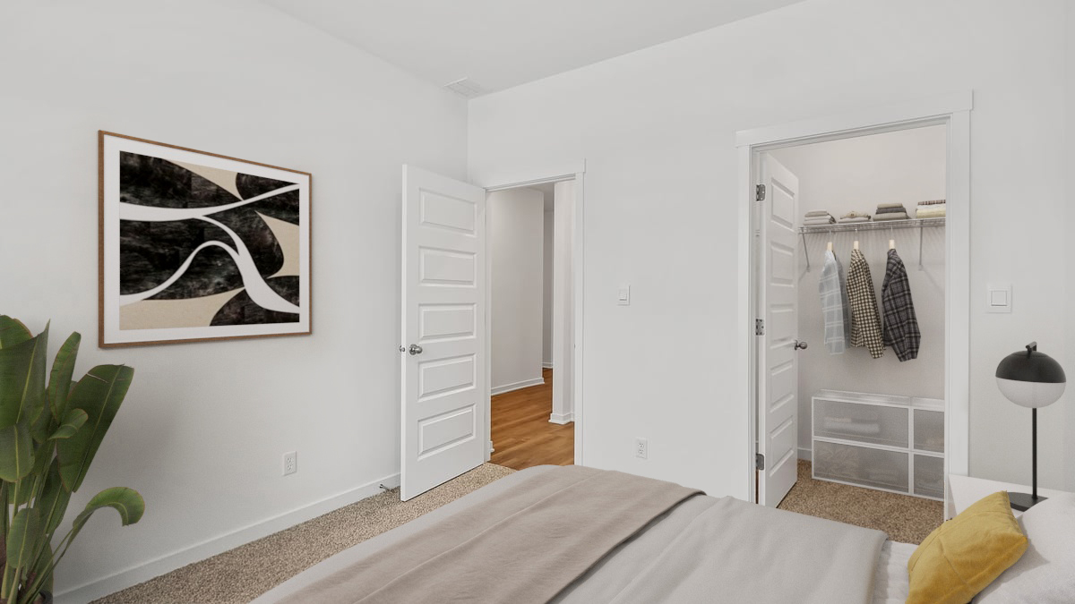 Bedroom with carpeted floors with a closet.