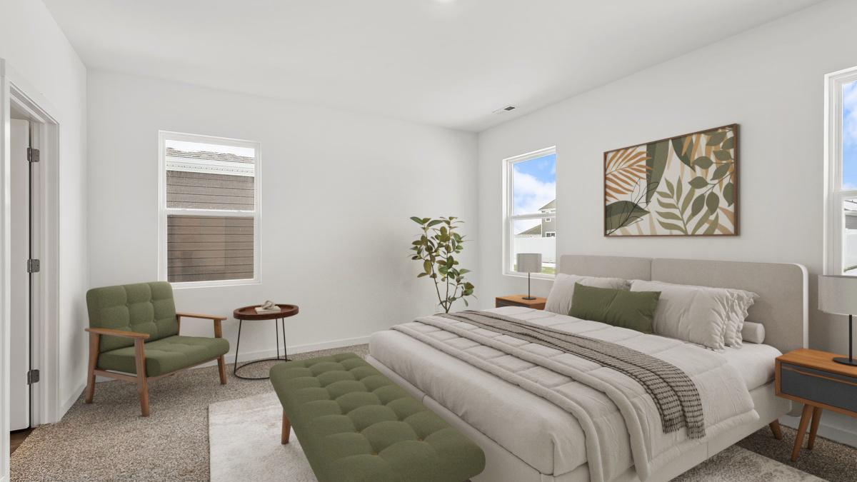 Bedroom with a side window and carpeted floors.