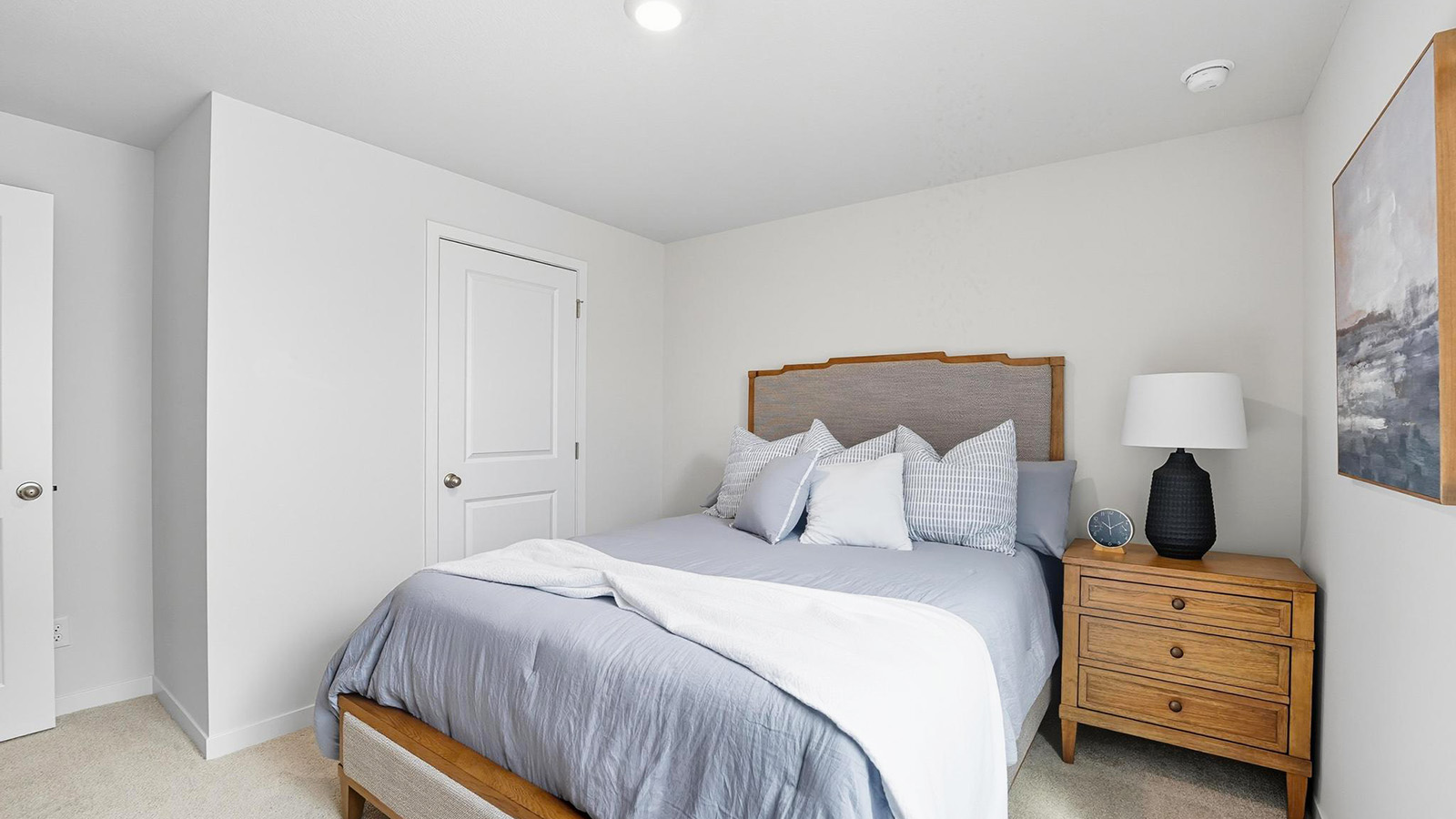 Carpeted bedroom with large windows