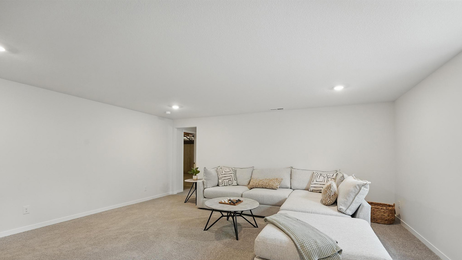 carpeted loft with large window