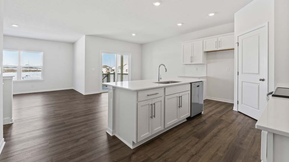open concept kitchen with large island and stainless steel appliances