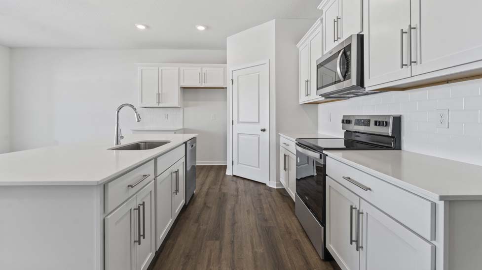 open concept kitchen with large island and stainless steel appliances