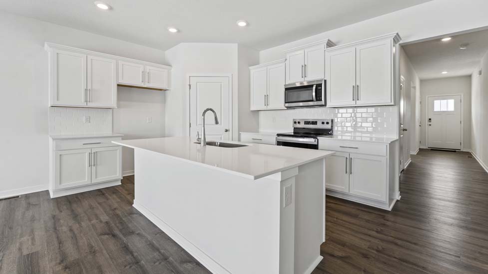 open concept kitchen with large island and stainless steel appliances