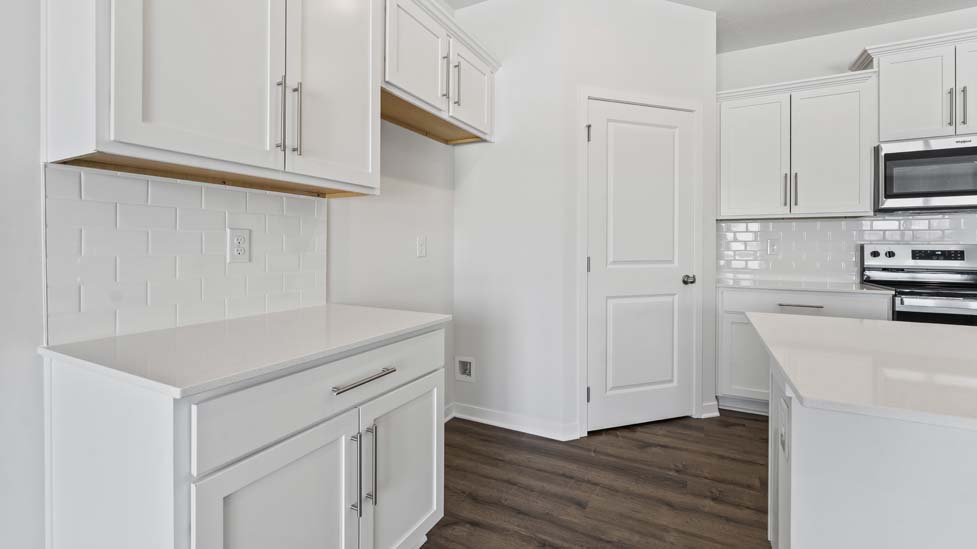 open concept kitchen with large island and stainless steel appliances