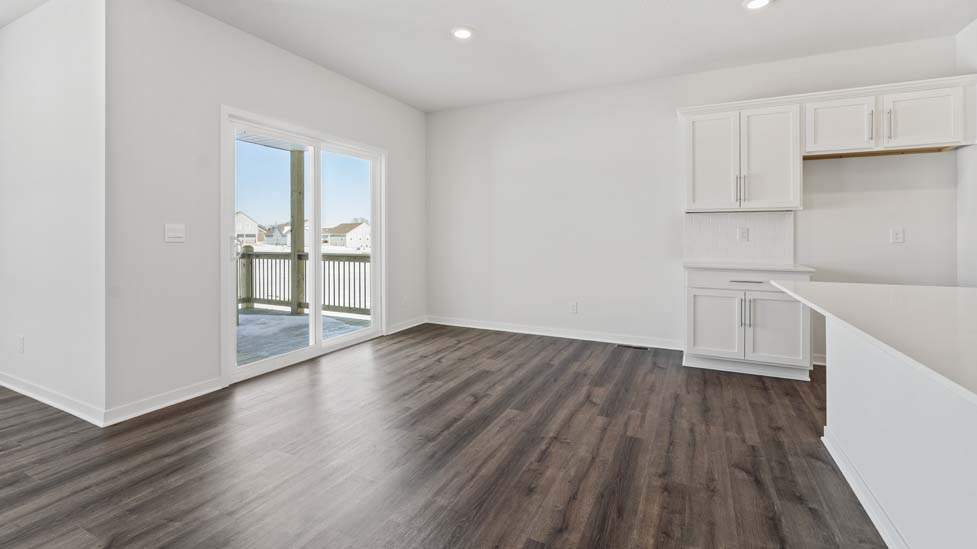 dining area off of kitchen with glass sliding door