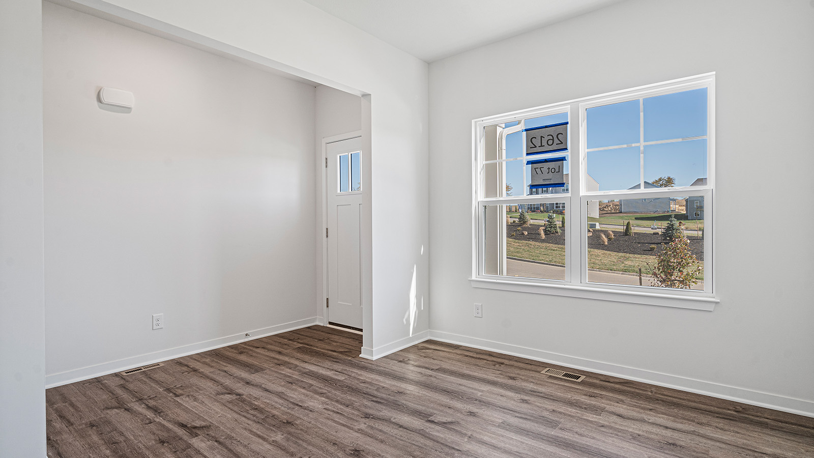 Flex room with large window and vinyl floors