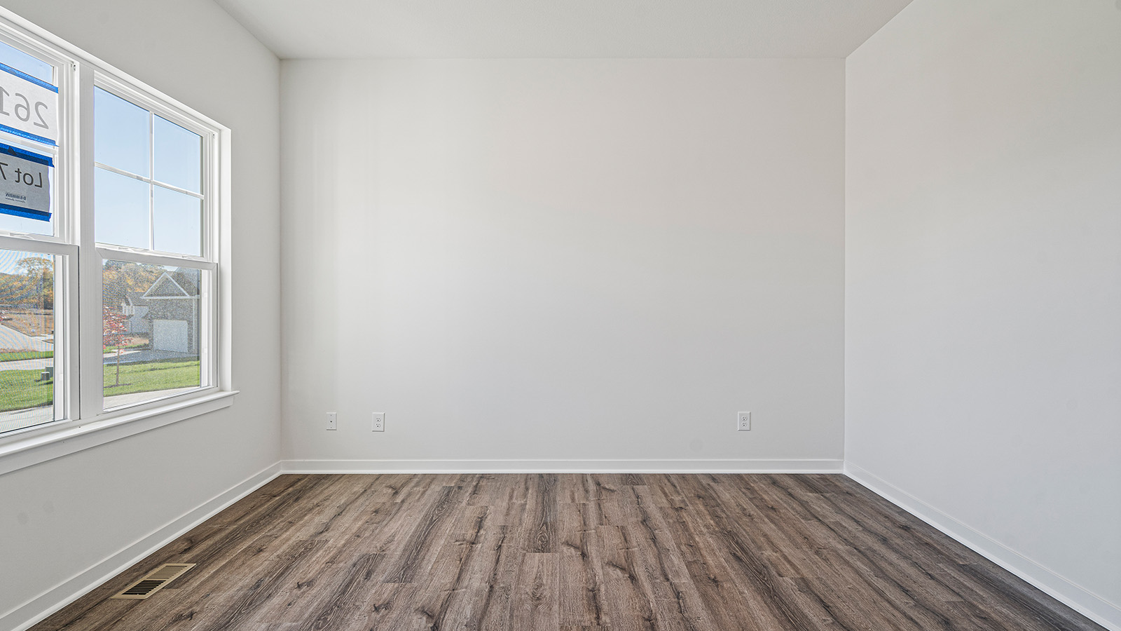 Flex room with large window and vinyl floors