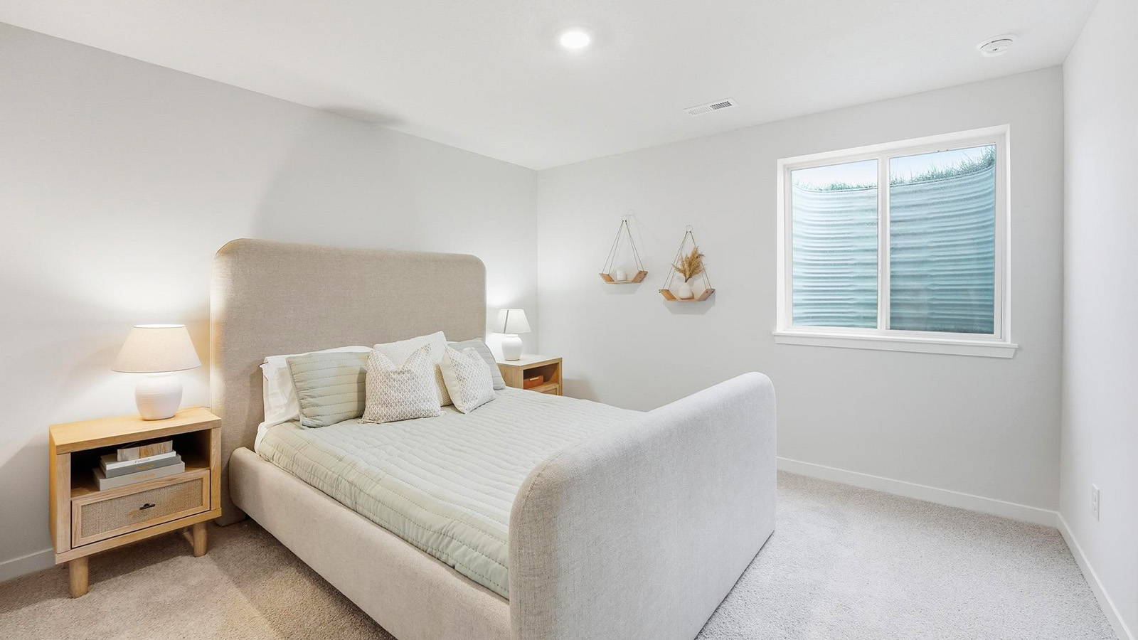 Carpeted bedroom with large window