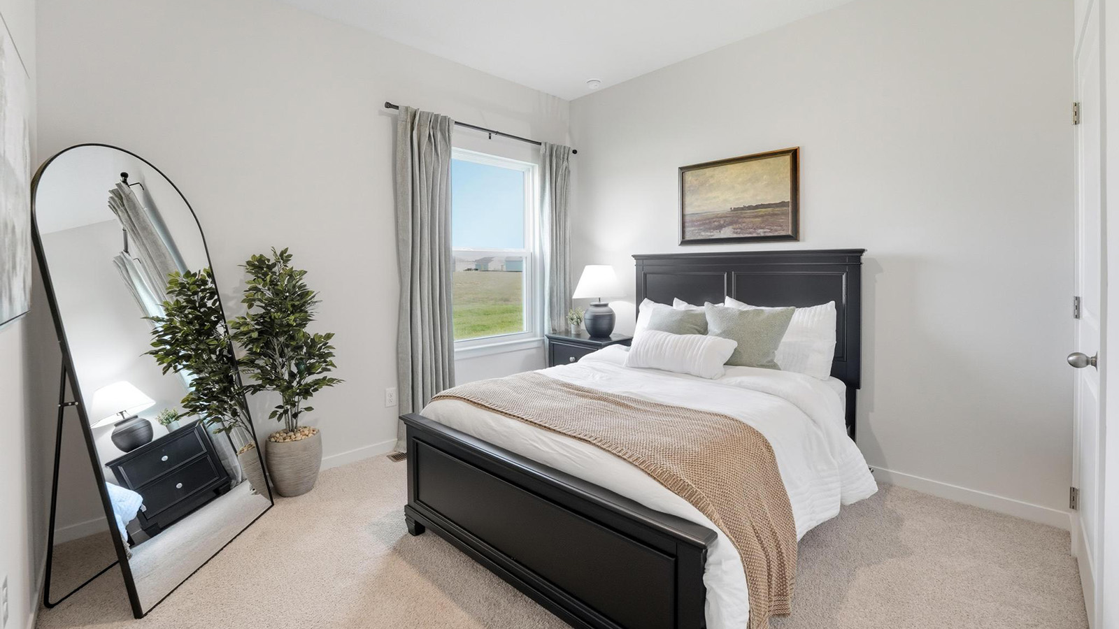 Carpeted bedroom with large window