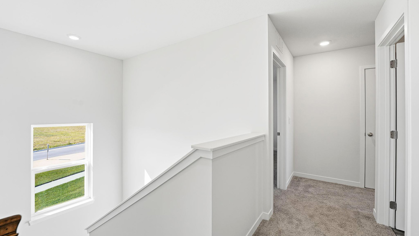 Carpeted Upstairs hallway.