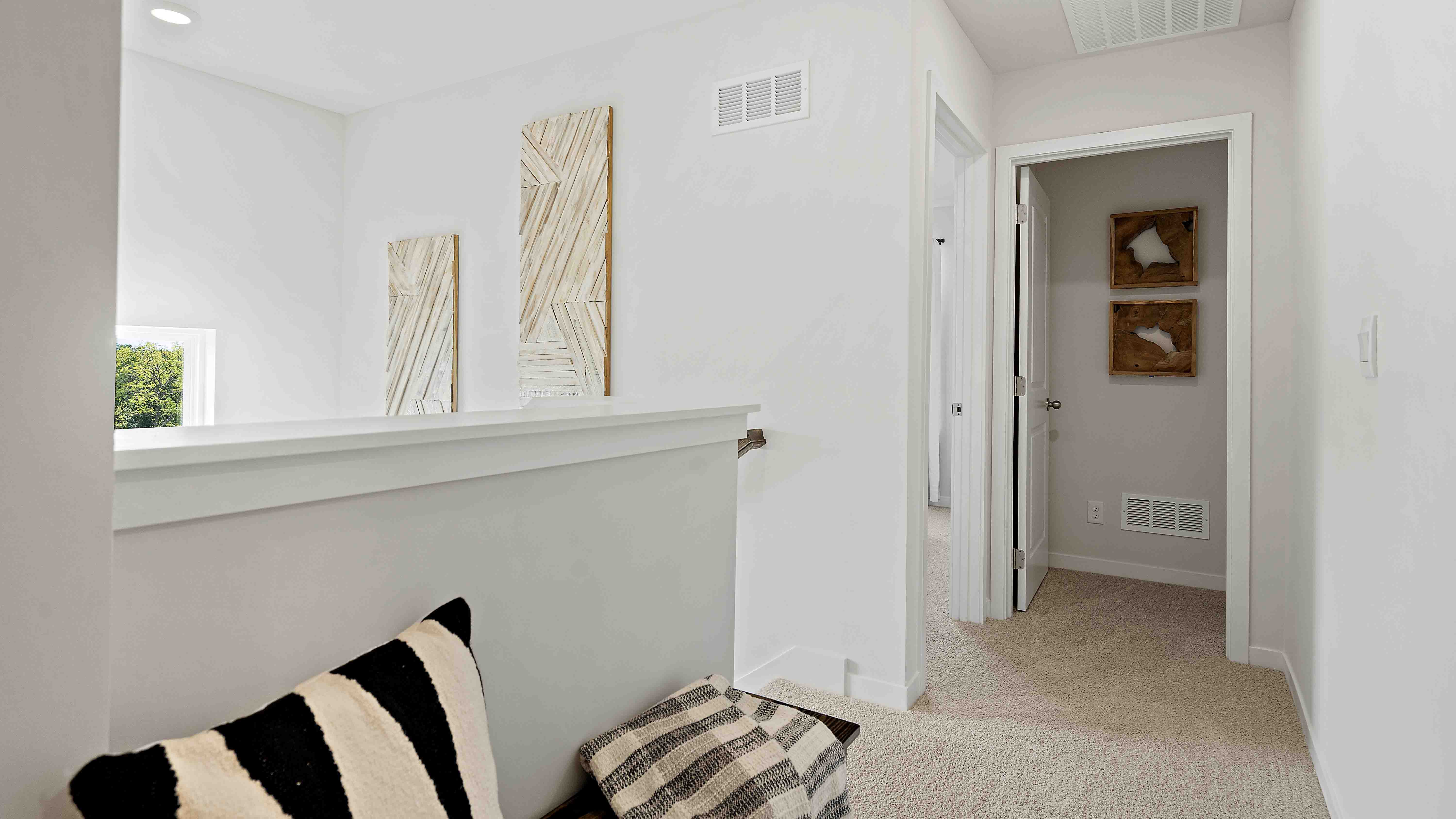 Carpeted Upstairs hallway.