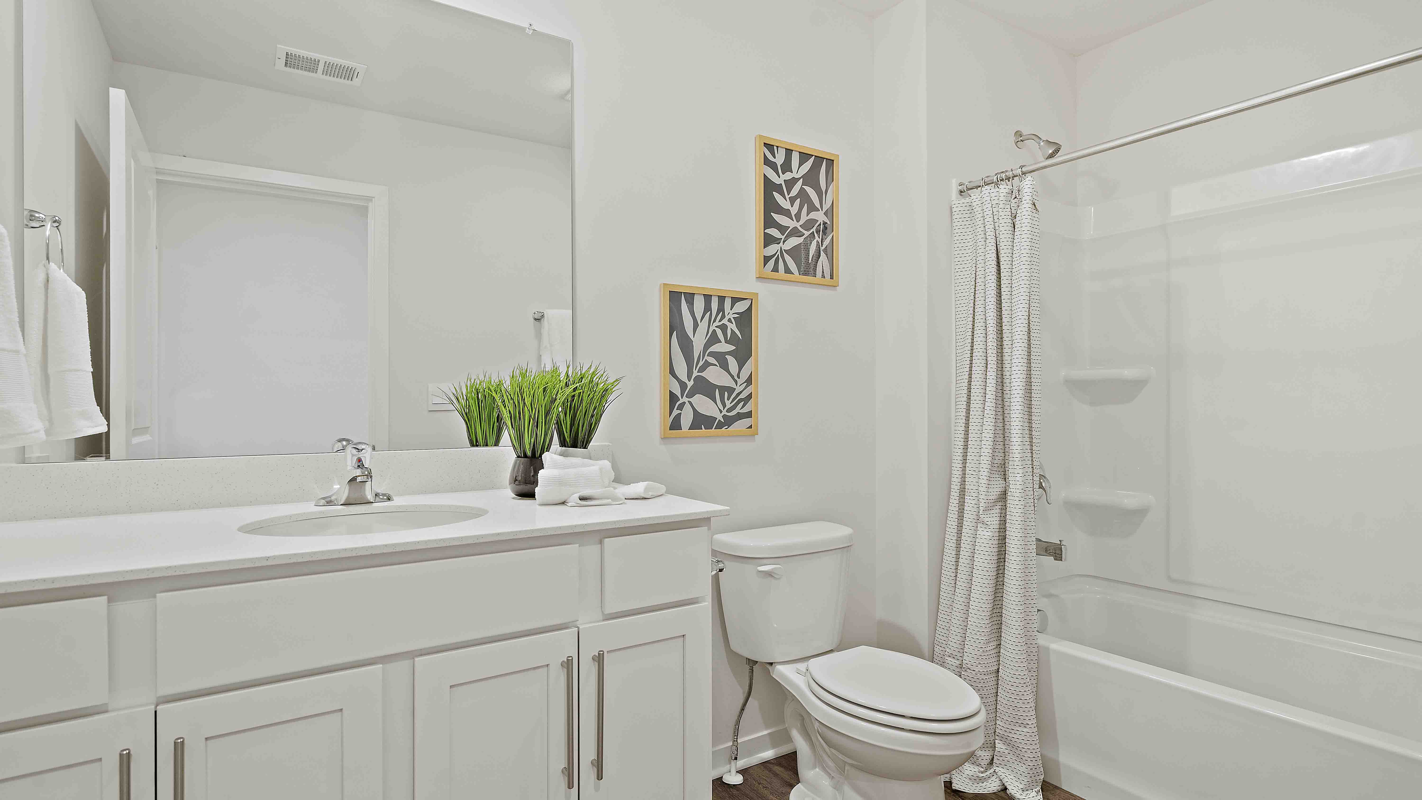 Bathroom with bathtub and shower combination.