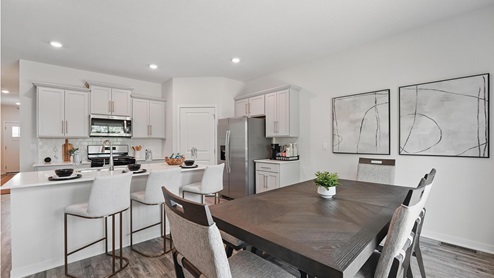 Dining area beside kitchen and living room. New Homes in Kansas City, Missouri