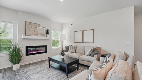 Living room with electric fireplace. New Homes in Kansas City, Missouri