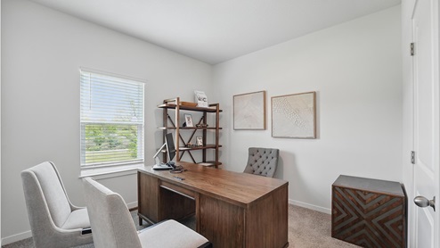 Office flex space with large window and carpet.