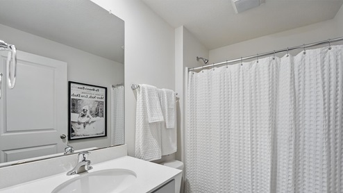 Bathroom with bathtub and shower combination. New Homes in Kansas City, Missouri