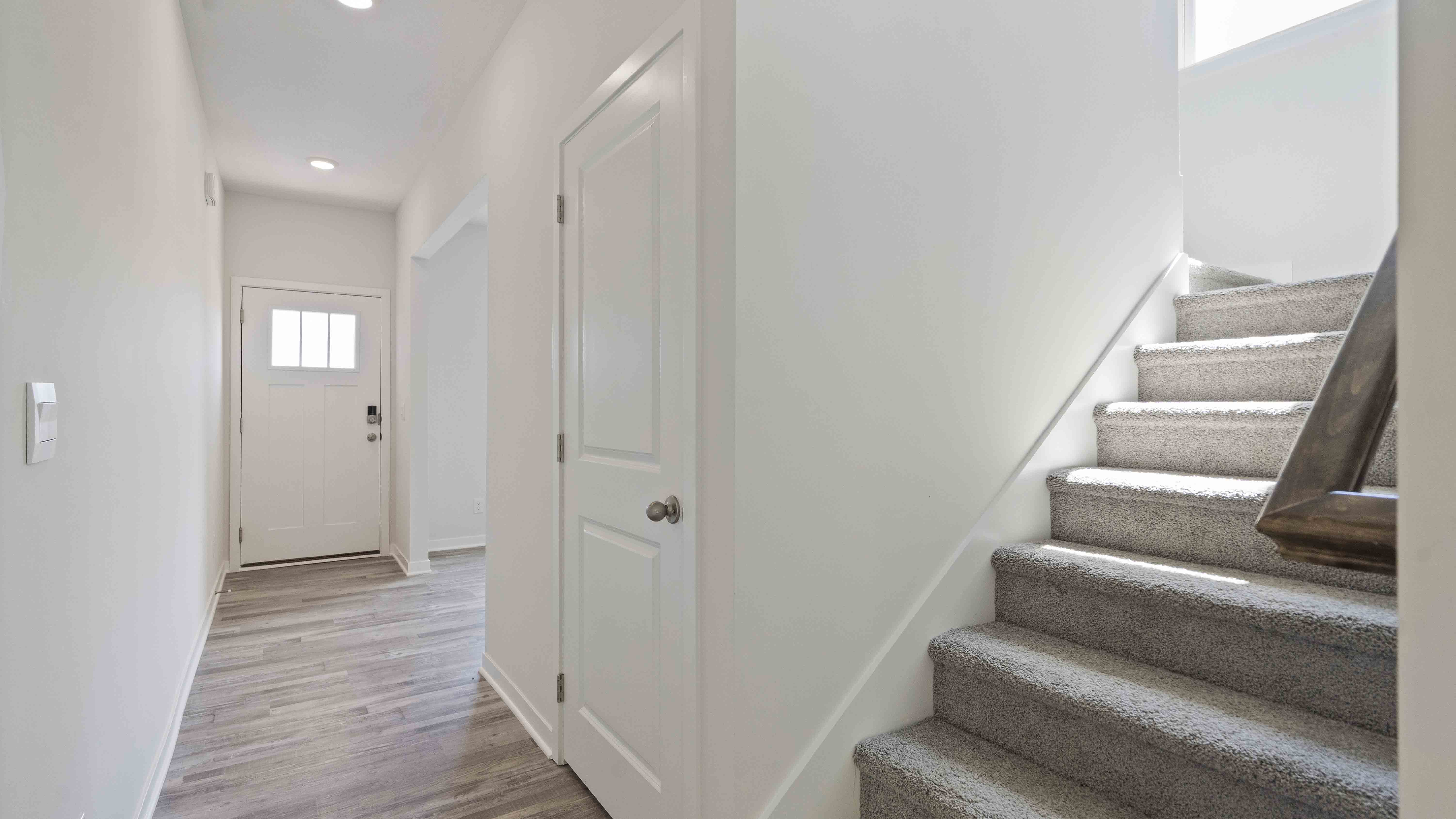 Welcoming foyer with view of staircase. New homes in Kansas City, Missouri