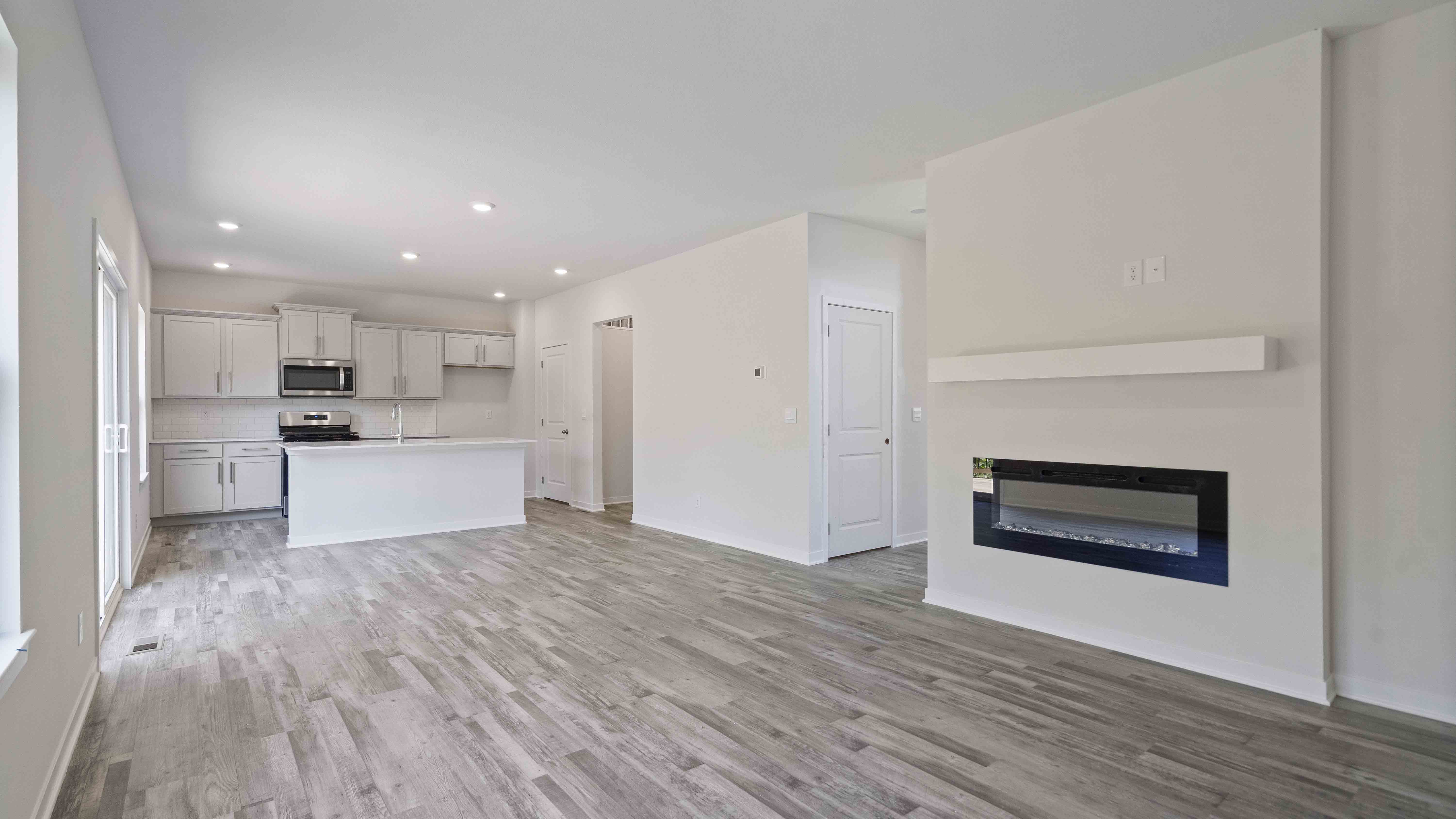Living room with electric fireplace. New Homes in Kansas City, Missouri