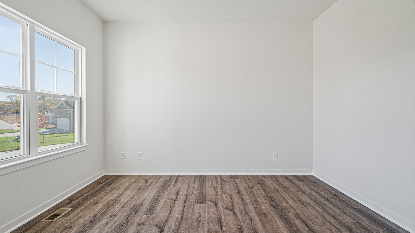 Flex room with large window and vinyl floors