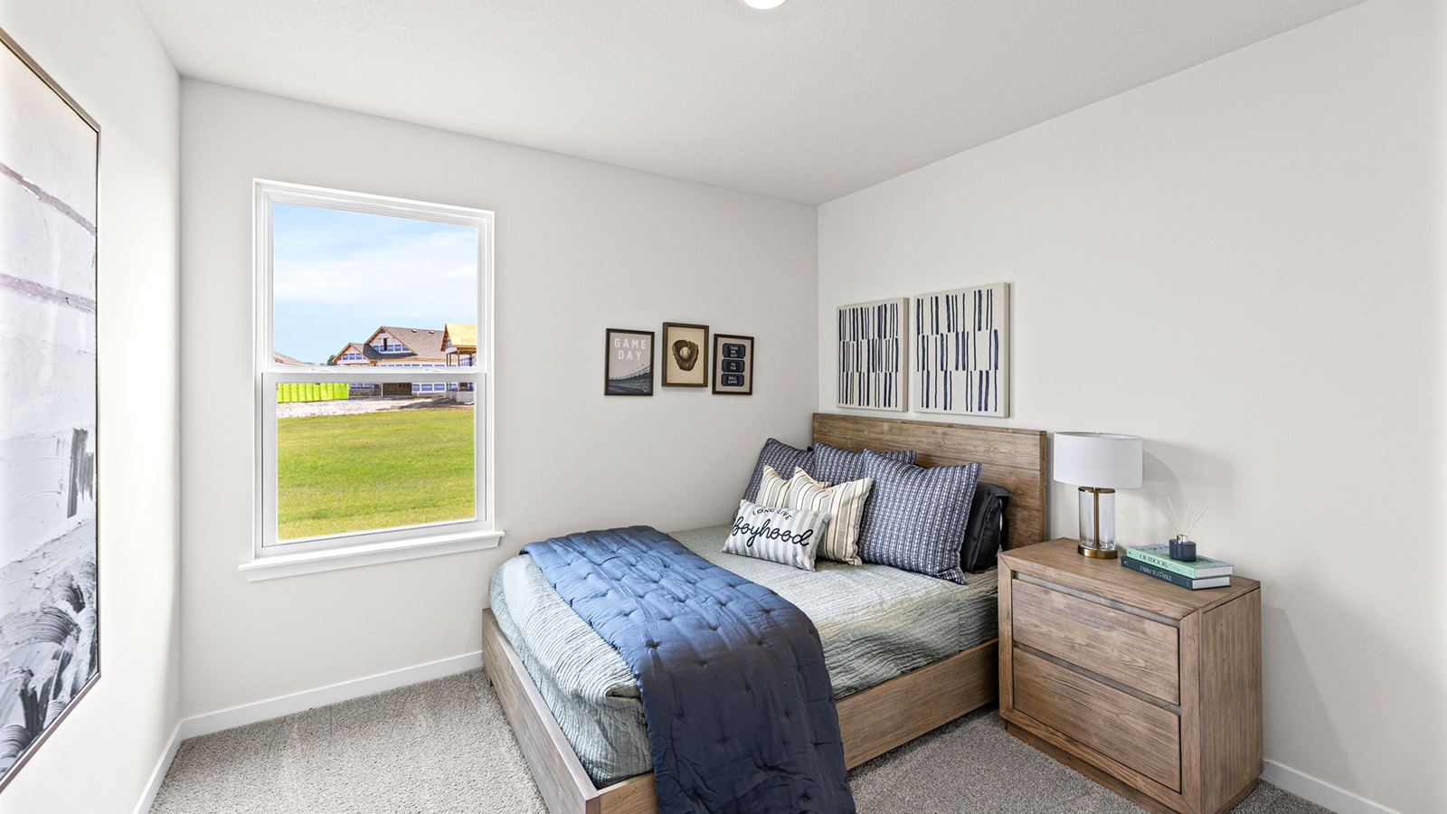Carpeted bedroom with large windows