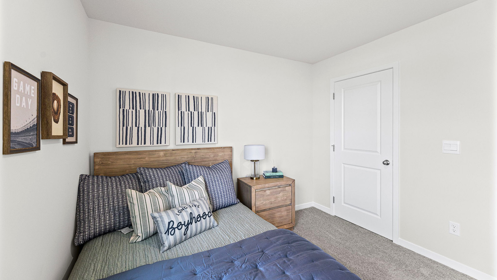 Carpeted bedroom with large windows