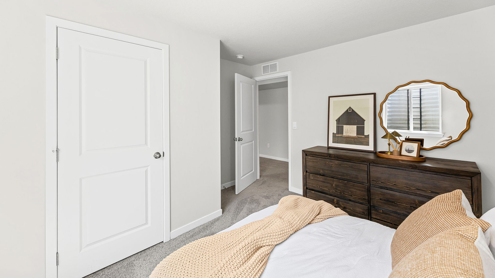 Carpeted bedroom with large window