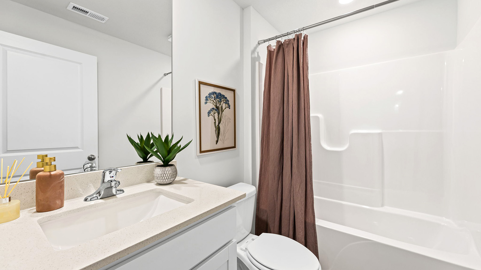 Bathroom with a bathtub shower combination