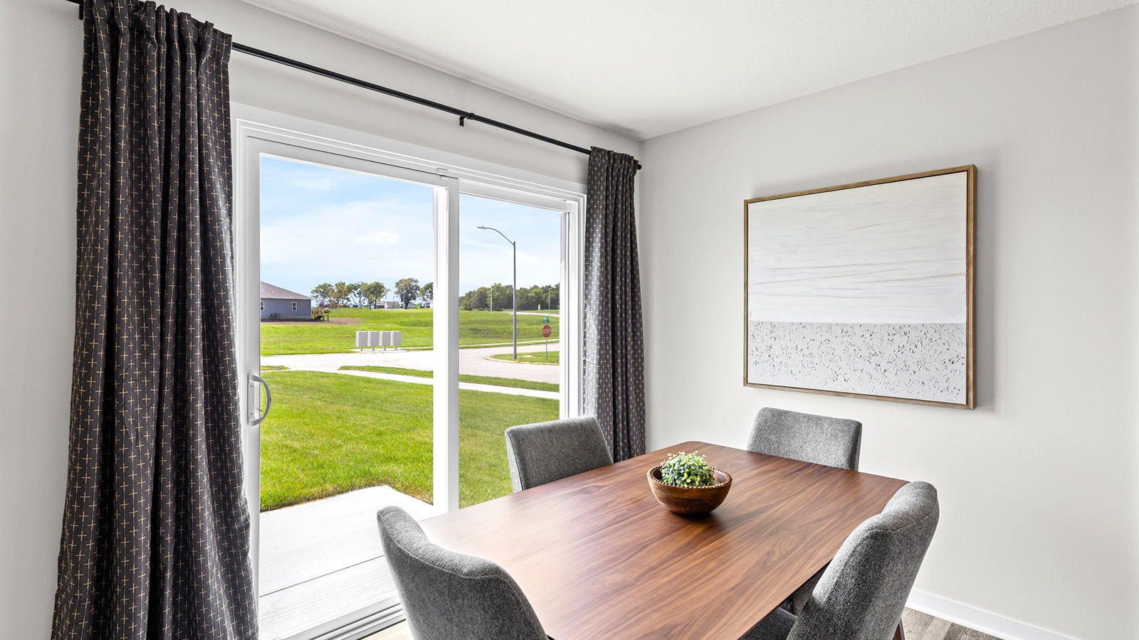 Dining area beside kitchen with sliding glass back door