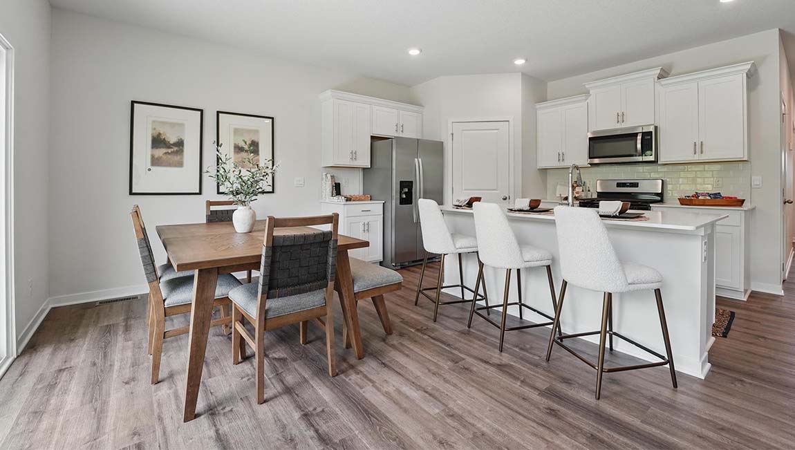 Dining area beside kitchen and living room.