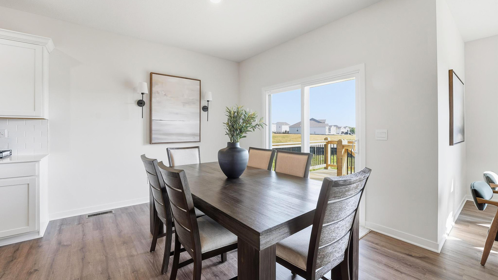 Dining area off of kitchen with glass sliding door
