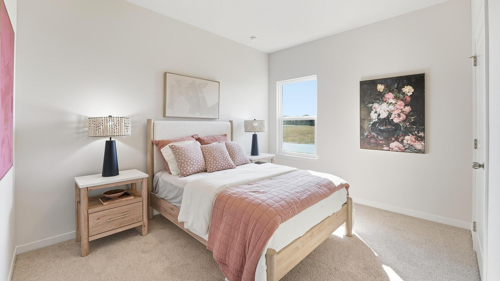 Carpeted bedroom with large window