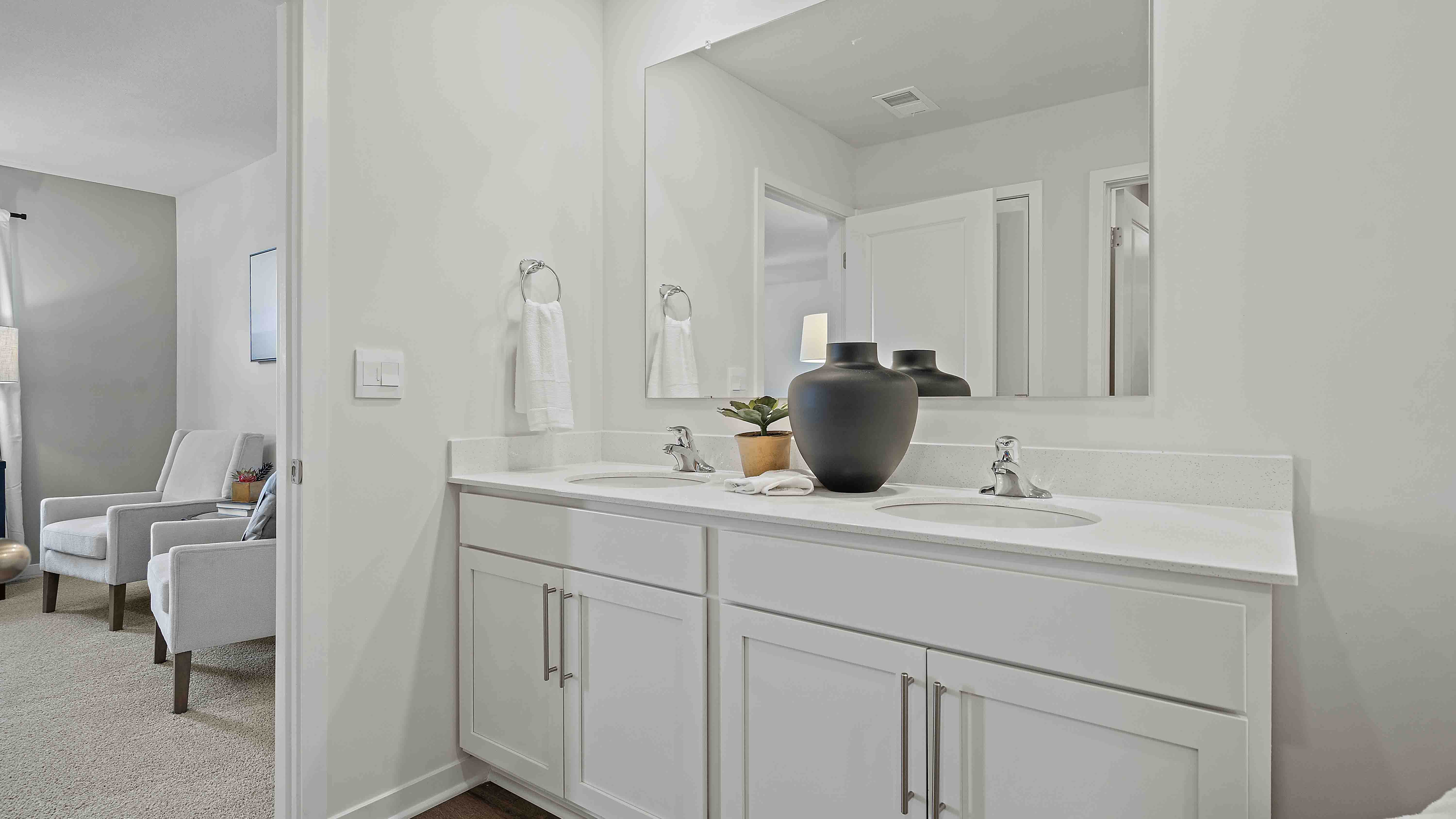 Primary bathroom with standing glass Door shower. New Homes in Kansas City, Missouri