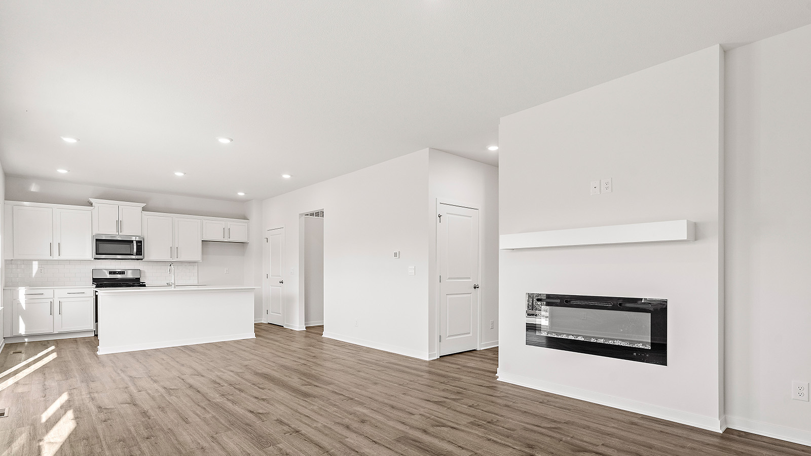 Living room with electric fireplace. New Homes in Kansas City, Missouri