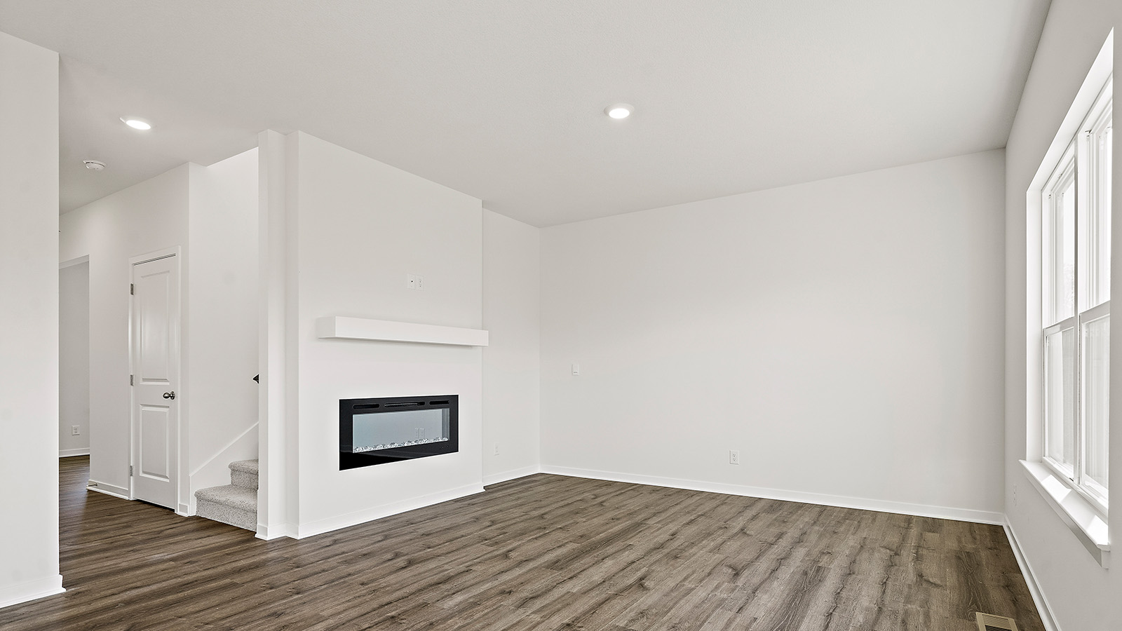 Living room with electric fireplace. New Homes in Kansas City, Missouri