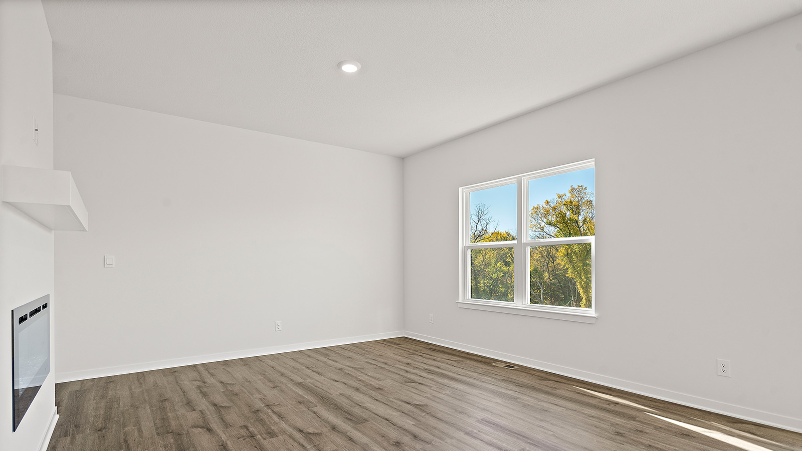 Living room with electric fireplace. New Homes in Kansas City, Missouri